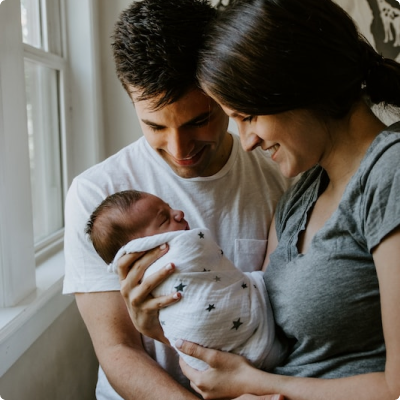 Happy Couple With Baby